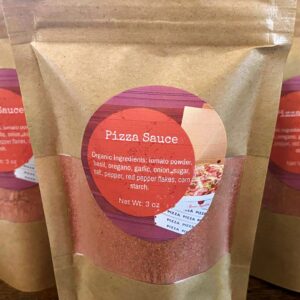 A 3 ounce packet of Organic Pizza Sauce Mix.